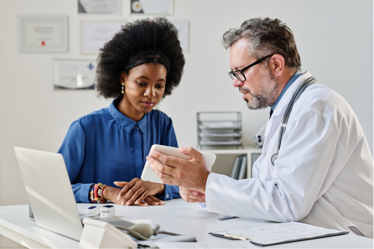 doctor talking to patient using emr system