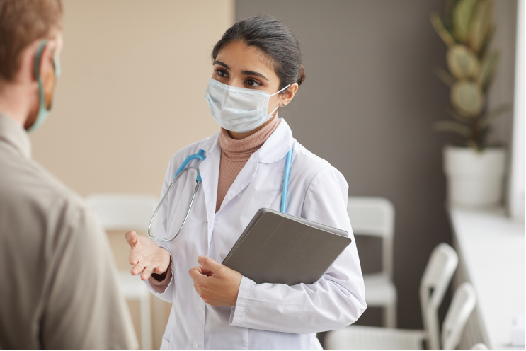 female doctor using emr system with patient